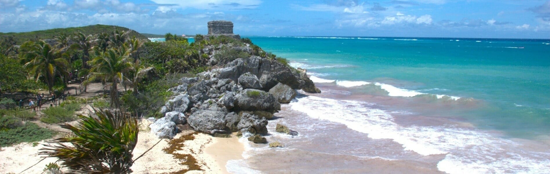 A ruin stood on beach and blue ocean