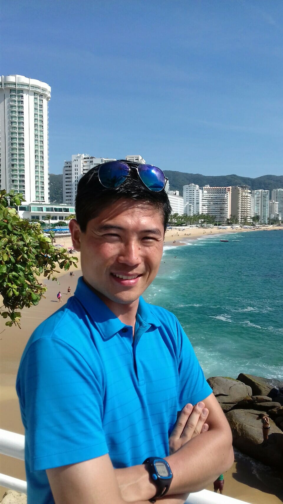 Mexican tourist guide Isao Iwasaki poses on the beach
